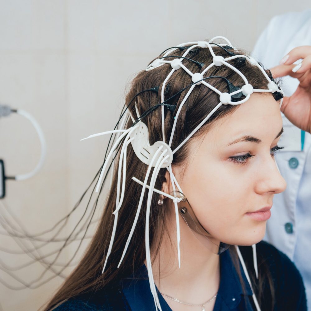 Doctor and patient with encephalography electrode. Electroencephalogram (EEG)